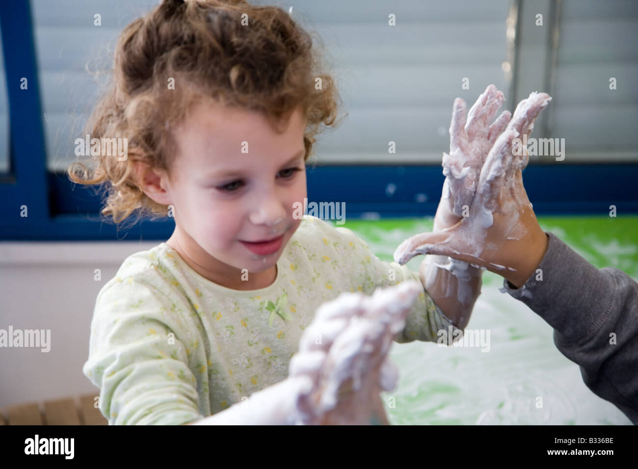 Five Year Old Girl Suffering from PDD in Occupational Therapy Stock Photo