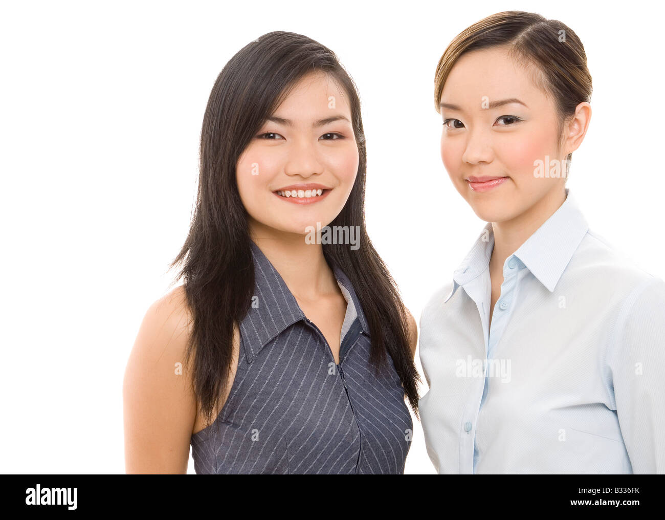 Two attractive and smiling asian businesswomen Stock Photo - Alamy