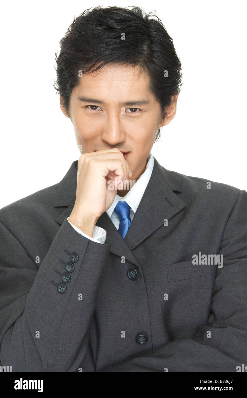 An asian businessman in grey suit with blue tie Stock Photo - Alamy