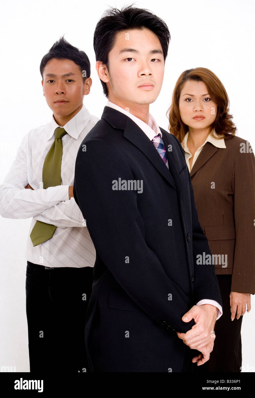 Three young business executives on a white background Stock Photo - Alamy