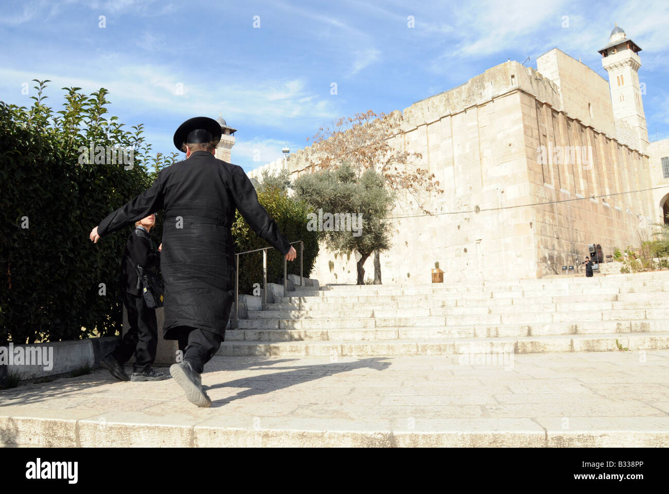 An ultra-Orthodox father & son pray at the Cave of the Patriarchs ...
