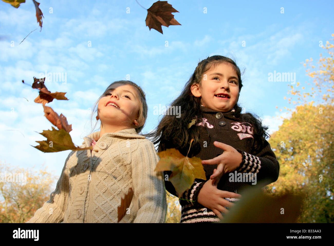 two girl and autum leaves Stock Photo