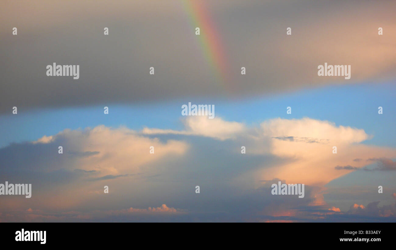 rainclouds with rainbow Stock Photo - Alamy