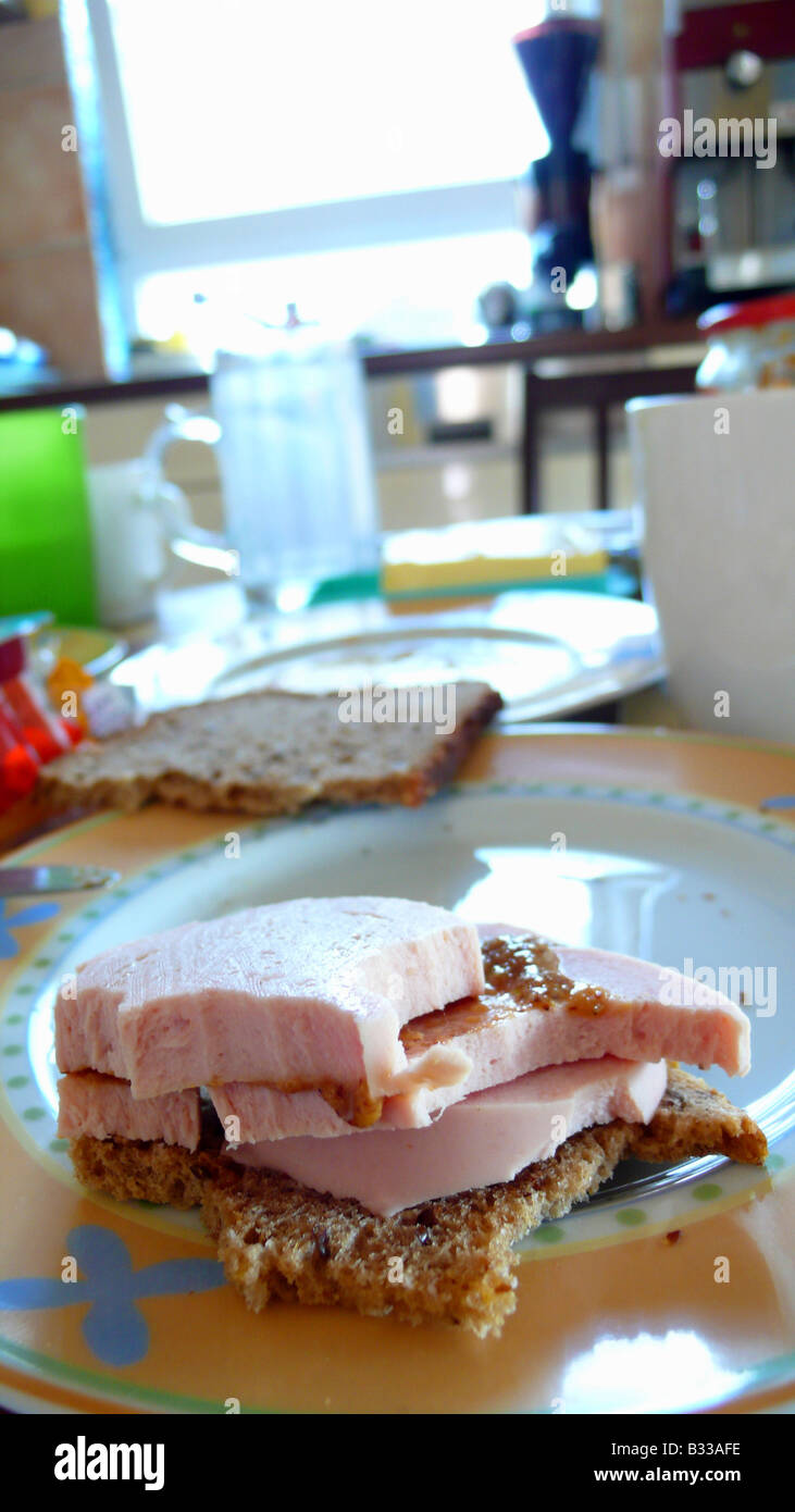 sausage sandwich on breakfast table Stock Photo