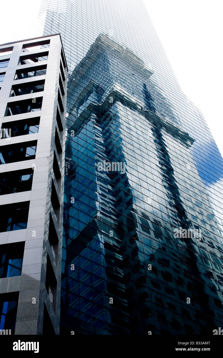 A tall glass covered skyscraper in Singapore Stock Photo