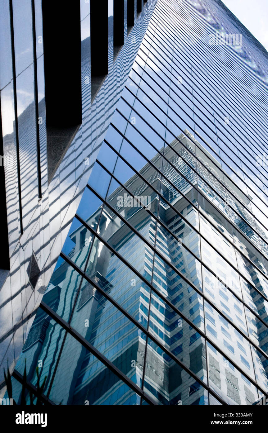 A glass skyscraper towers into the Singapore sky Stock Photo