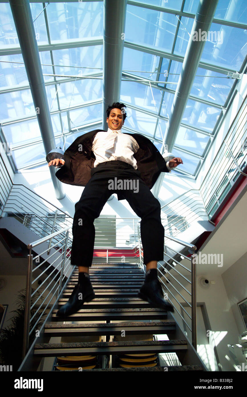 a businessman cutting a caper Stock Photo Alamy