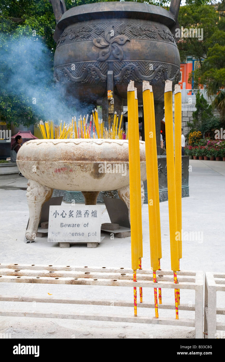 Large incense sticks burn at Buddhist monastery in China Stock Photo