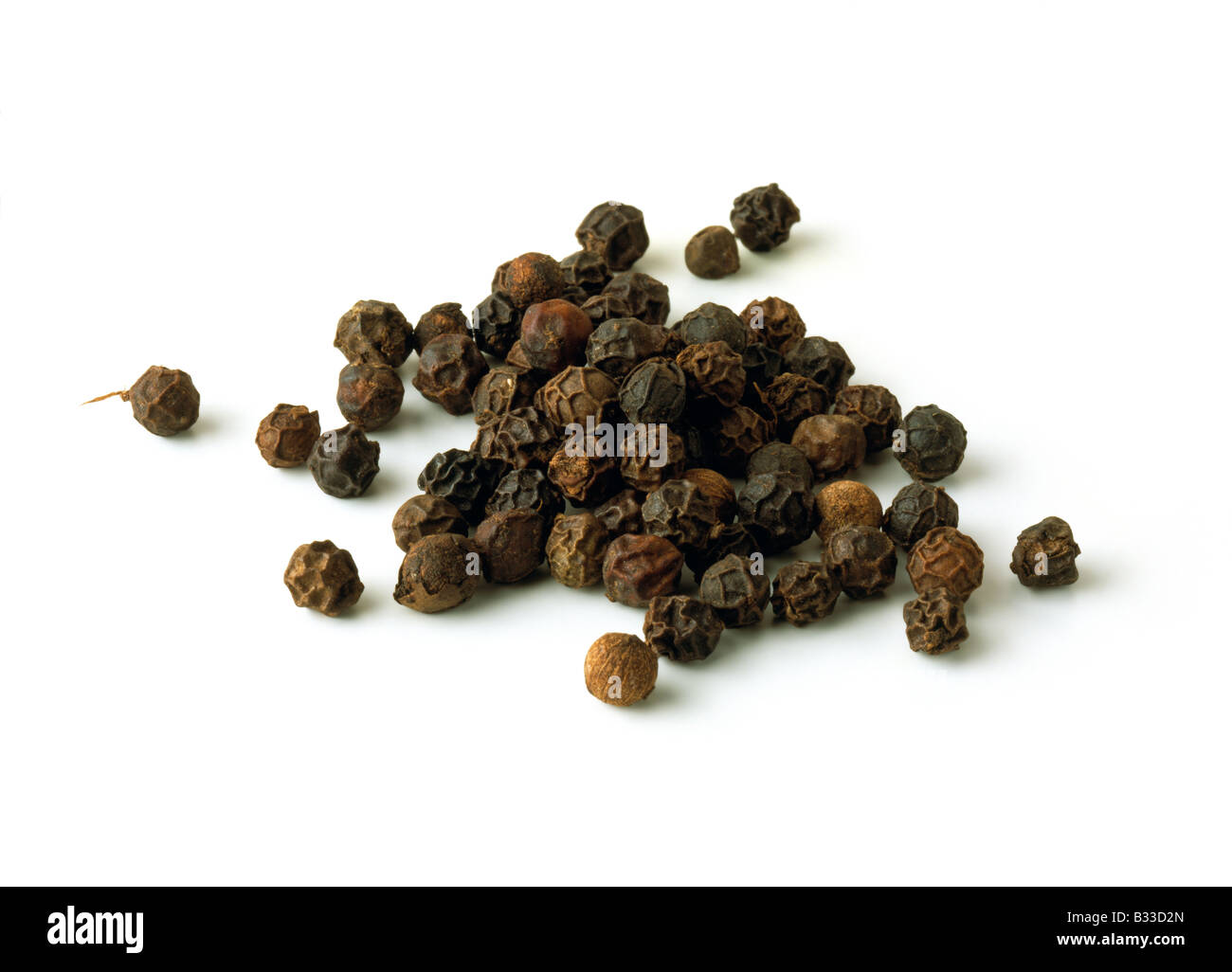 A pile of black peppercorns spices editorial food Stock Photo