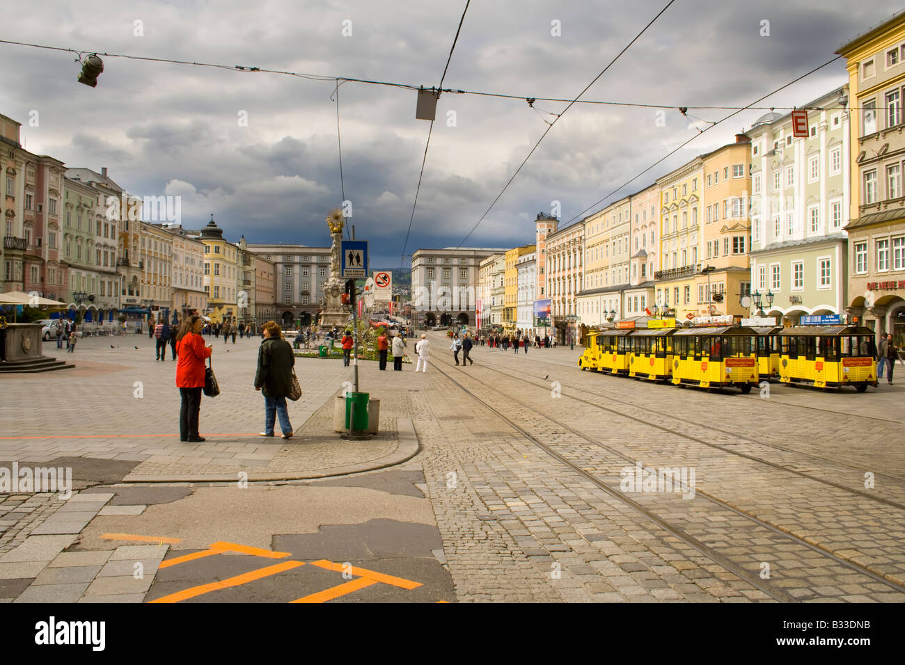 Hauptplatz Linz with Passing Tram and Baroque Architecture Stock Photo