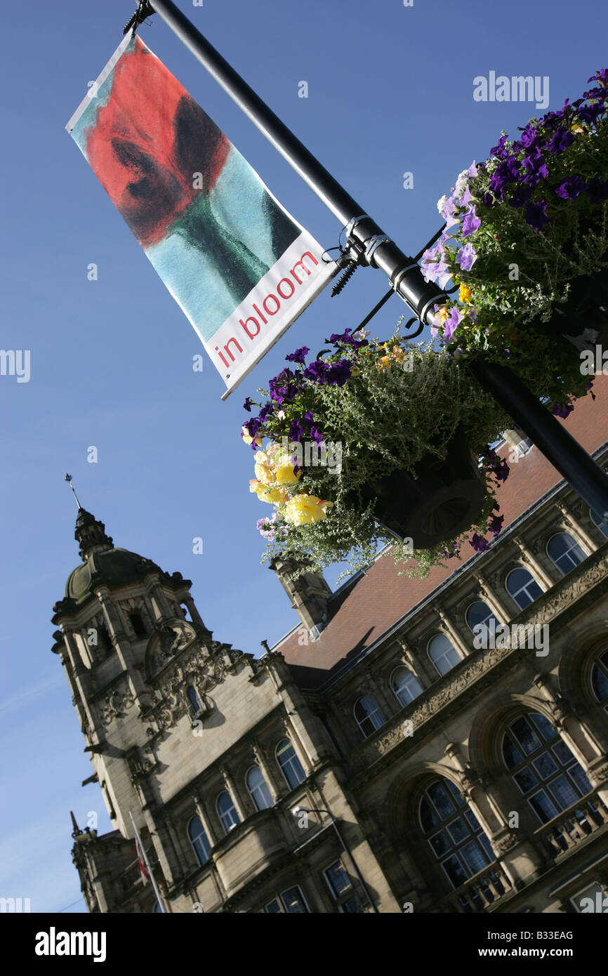City of Wakefield, England. Angled view of the Wakefield City in Bloom (CiB) banner and flower baskets. Stock Photo