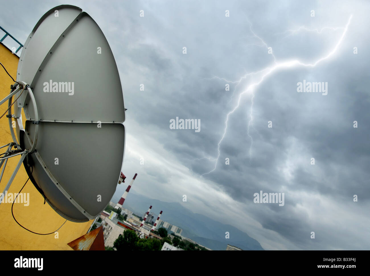 Creative photo of the high tech parabolic antenna and lightning Stock