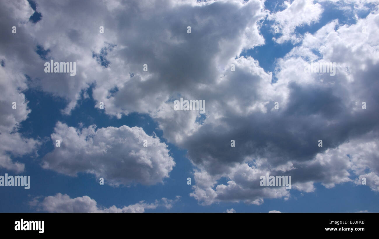 Fluffy white clouds and blue sky Stock Photo - Alamy