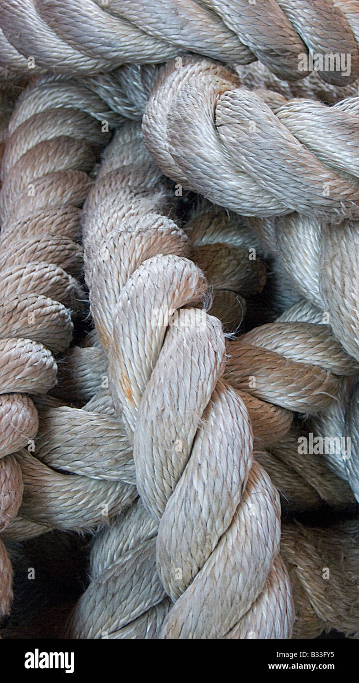Close up of thick fat white ropes with many twisted ply Stock