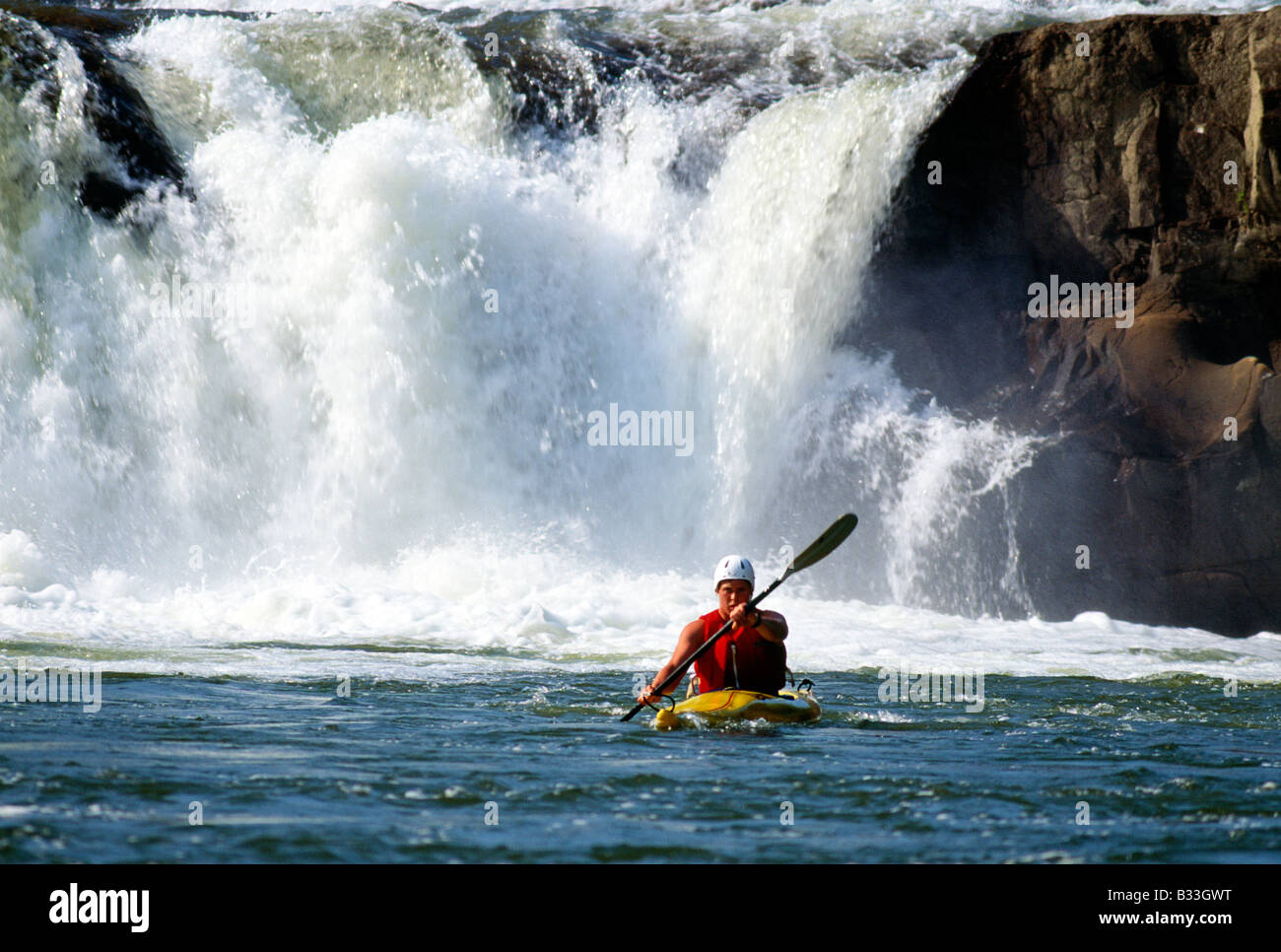 YOUNG MAN KAYAKING IN YOUGHIOGHENY RIVER, OHIOPYLE STATE PARK
