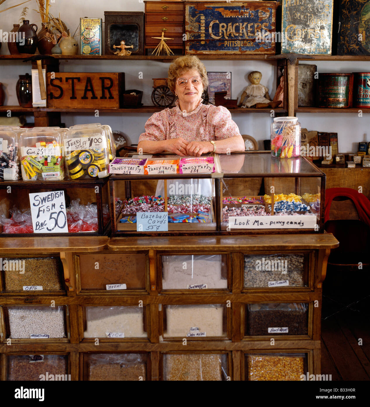 Woman in old fashioned candy store, New Bedford Village, Bedford, Pennsylvania Stock Photo