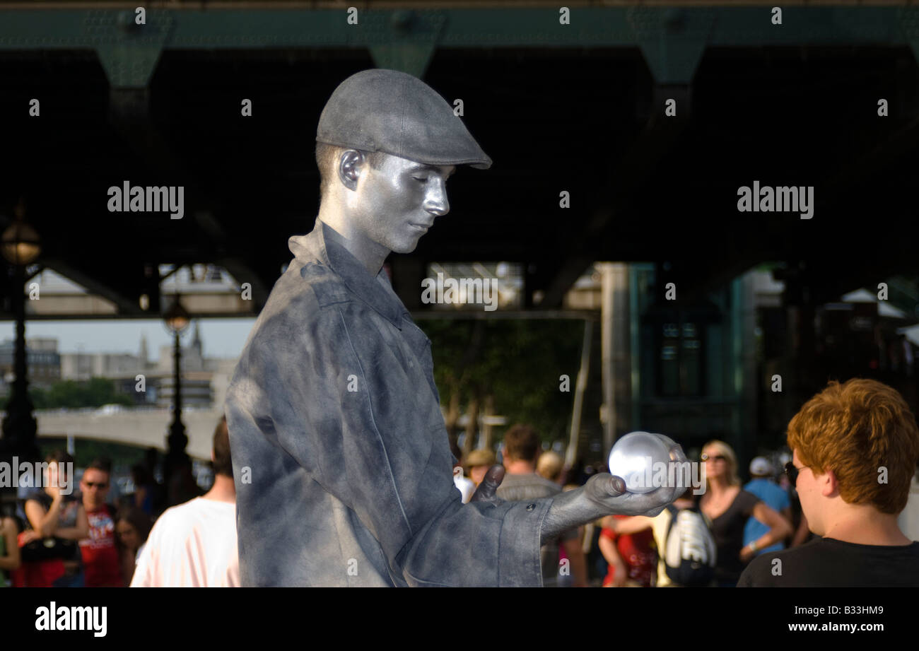 Silver coloured Street performer on the South Bank, London England Stock Photo