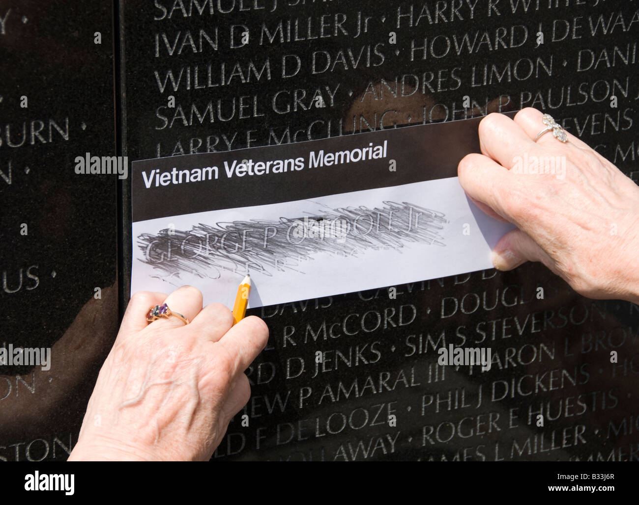 doing-a-rubbing-of-a-name-of-a-dead-soldier-at-the-vietnam-veterans