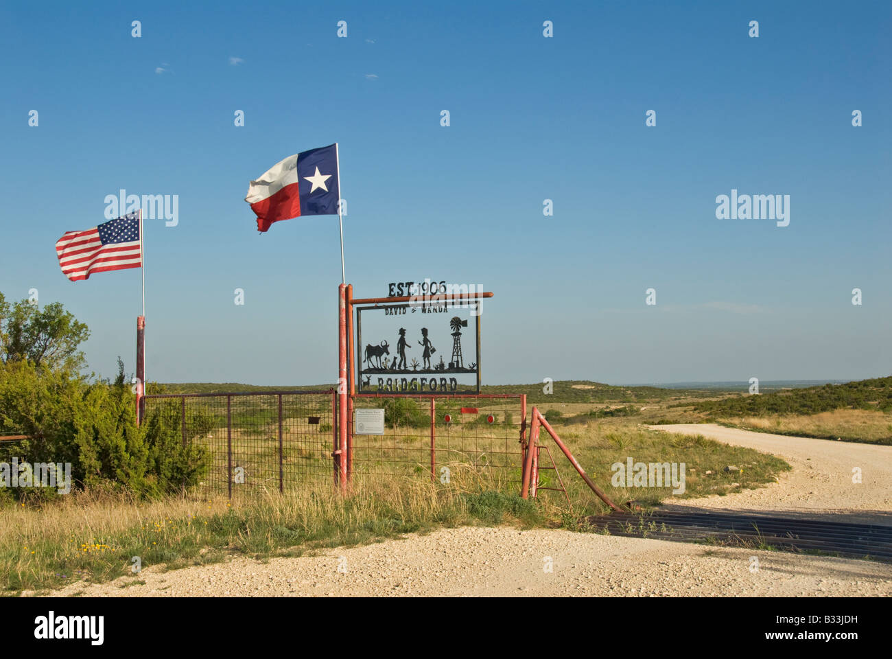 Texas Panhandle Plains Historic Ranch in continuous agricultural operation by same family for over 100 years sign flags Stock Photo