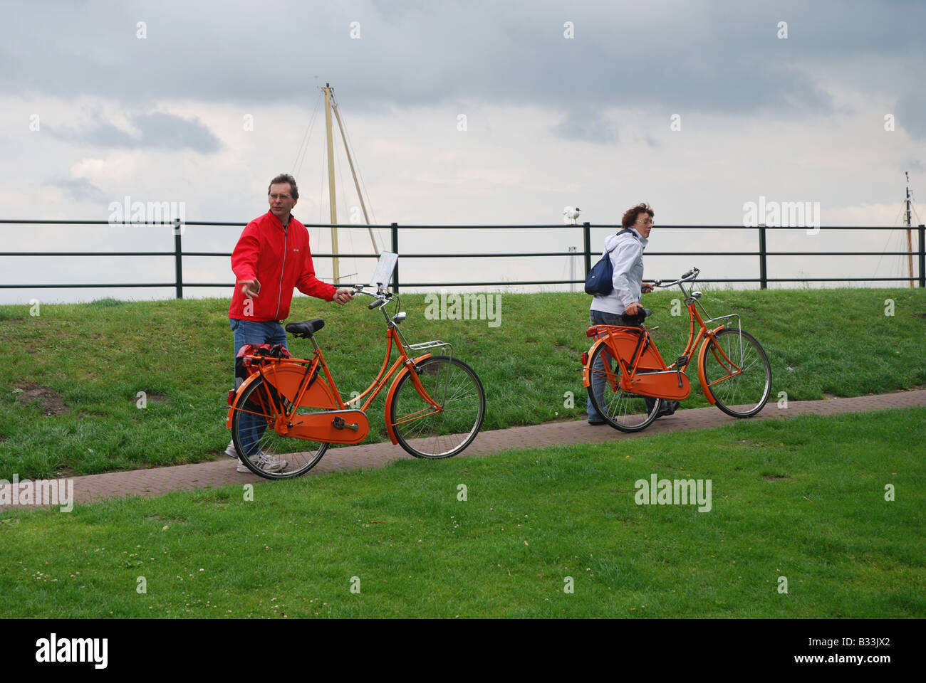 Cyclists walking uphill hi-res stock photography and images - Alamy