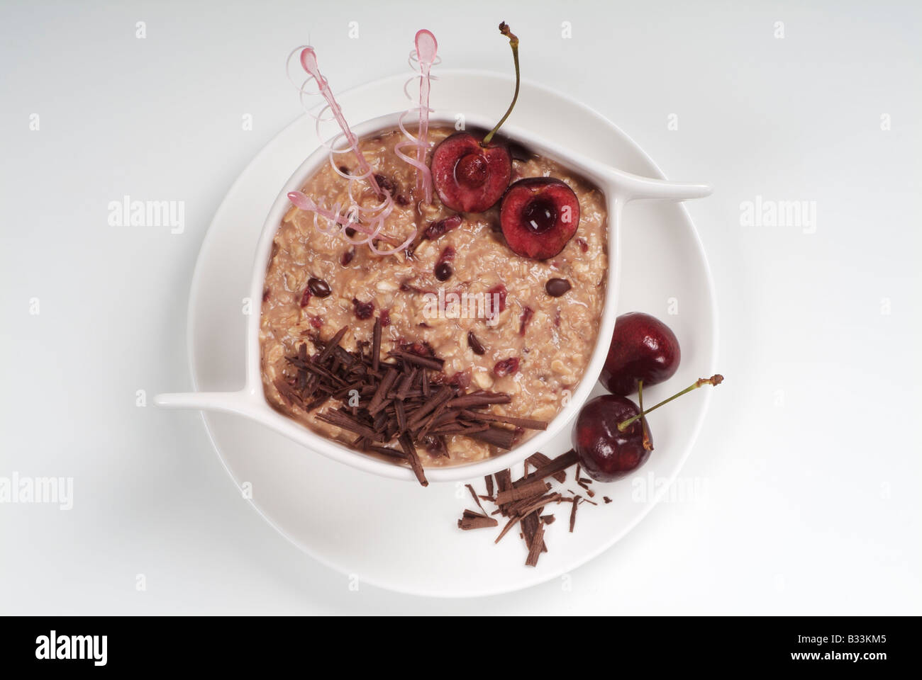Bowl of Cherry Fool Decorated with Fresh Cherries and Grated Chocolate Stock Photo