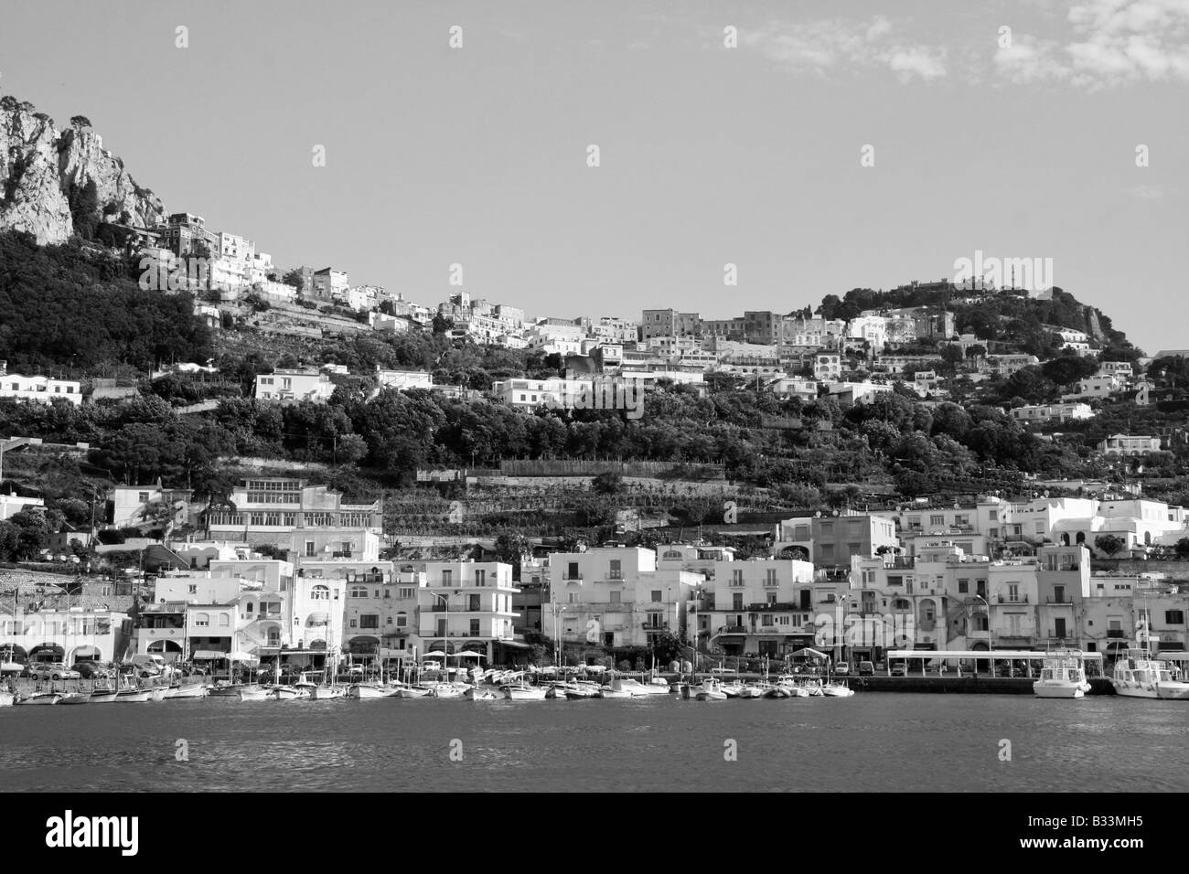 The island of Capri as seen from its port, in Italy, in Black and White Stock Photo