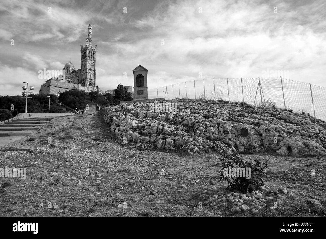 A view of the Basilica of Notre-Dame de la Garde in Marseille, France, in Black and White Stock Photo