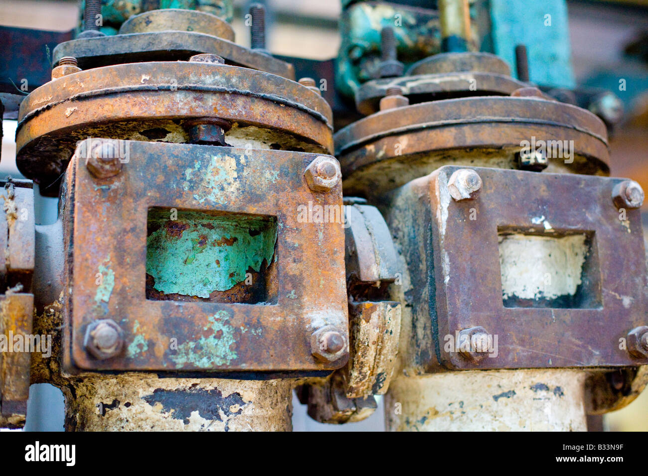 rusting disused machinery in an industrial setting Stock Photo