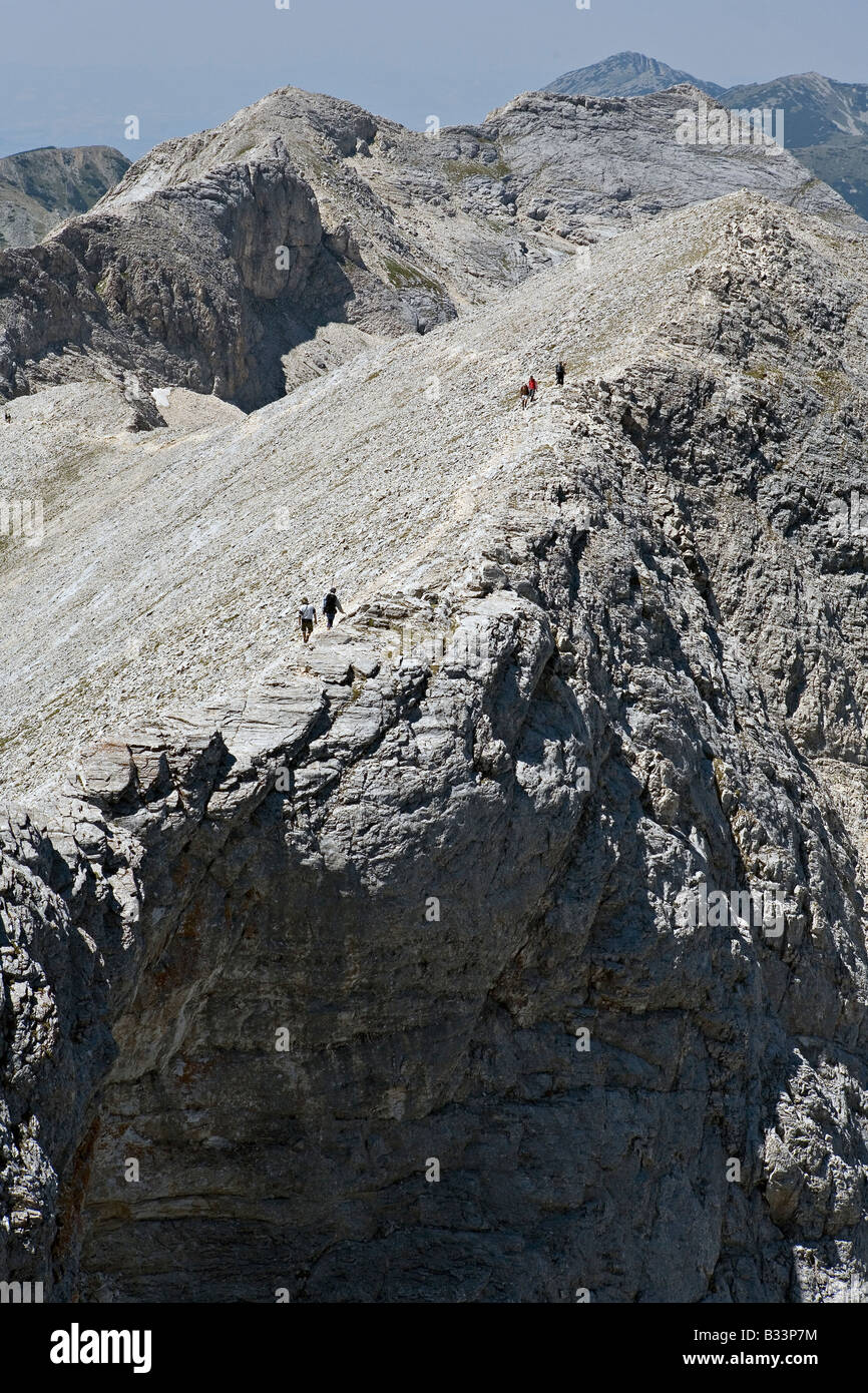 Travelers on Koncheto mountain crest in World Heritage Site Pirin National Park Bulgaria Stock Photo
