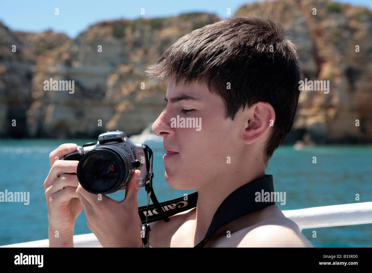 portrait of a teenager with a camera Stock Photo