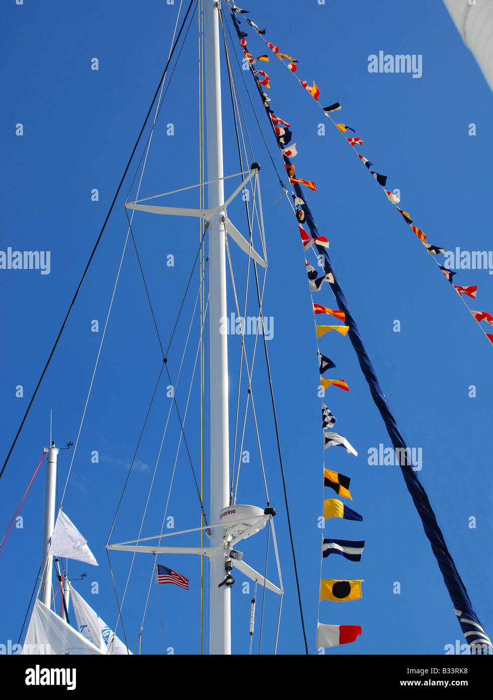 Flying Flags on the mast of a sailboat Stock Photo Alamy