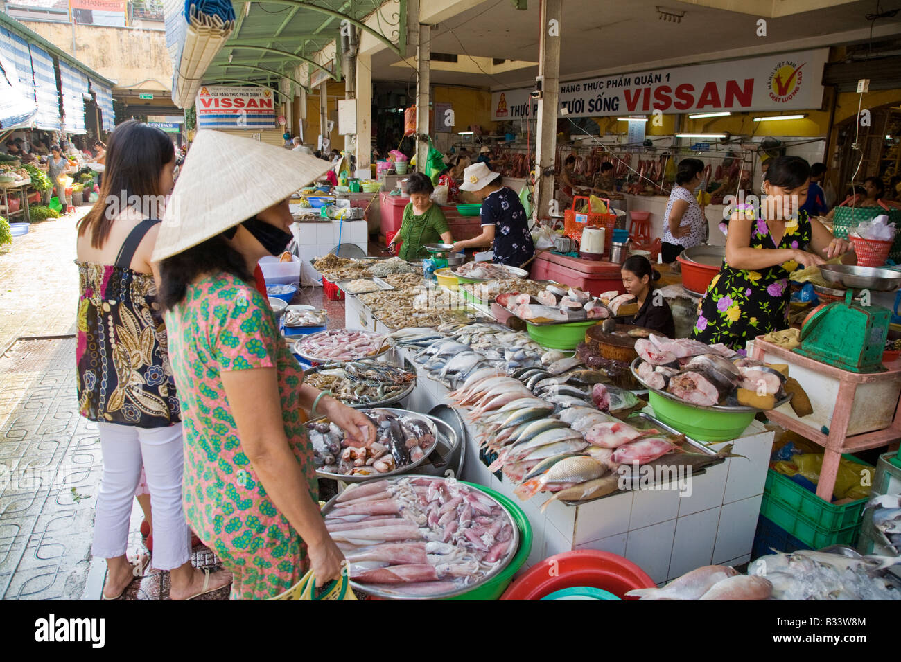 Woman at a vietnamese market in Saigon, Vietnam Stock Photo