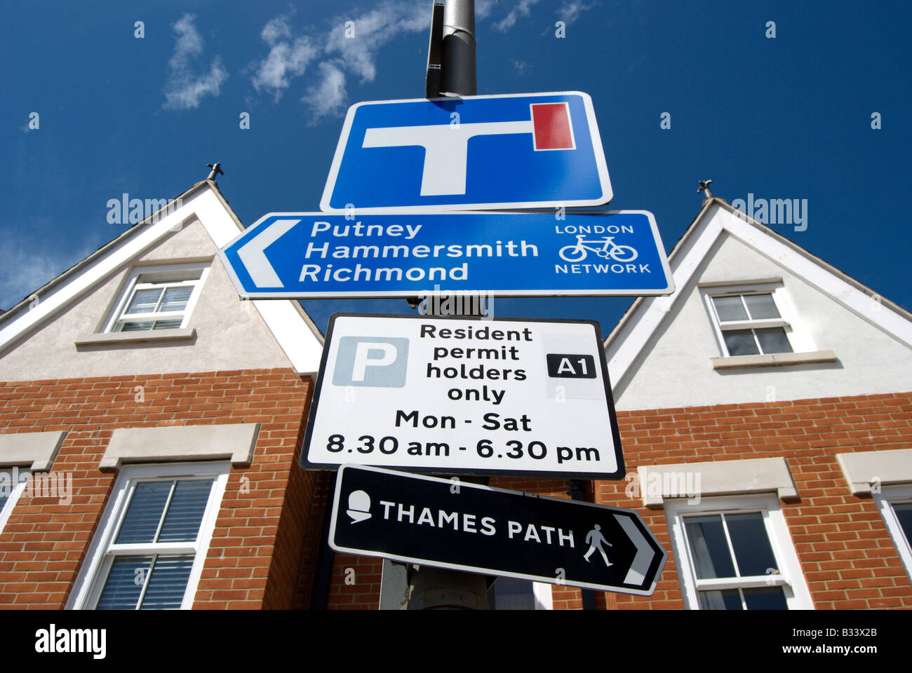parking, cycling and walking street signs in putney, southwest london, england Stock Photo