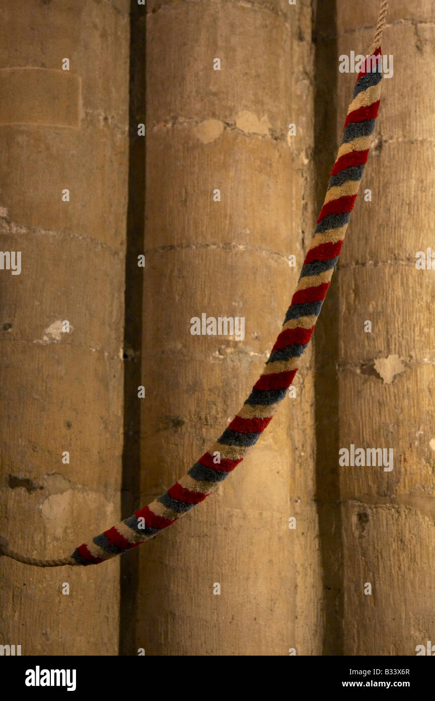 End of bell rope against a stone pillar Holy Trinity Church in Kingston