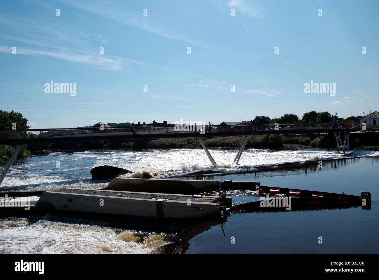 The new footbridge adjacent to the flour mill and the weir between Aire