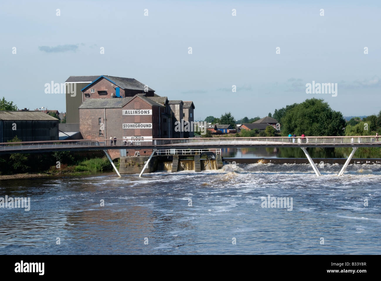 The new footbridge adjacent to the flour mill and the weir between Aire