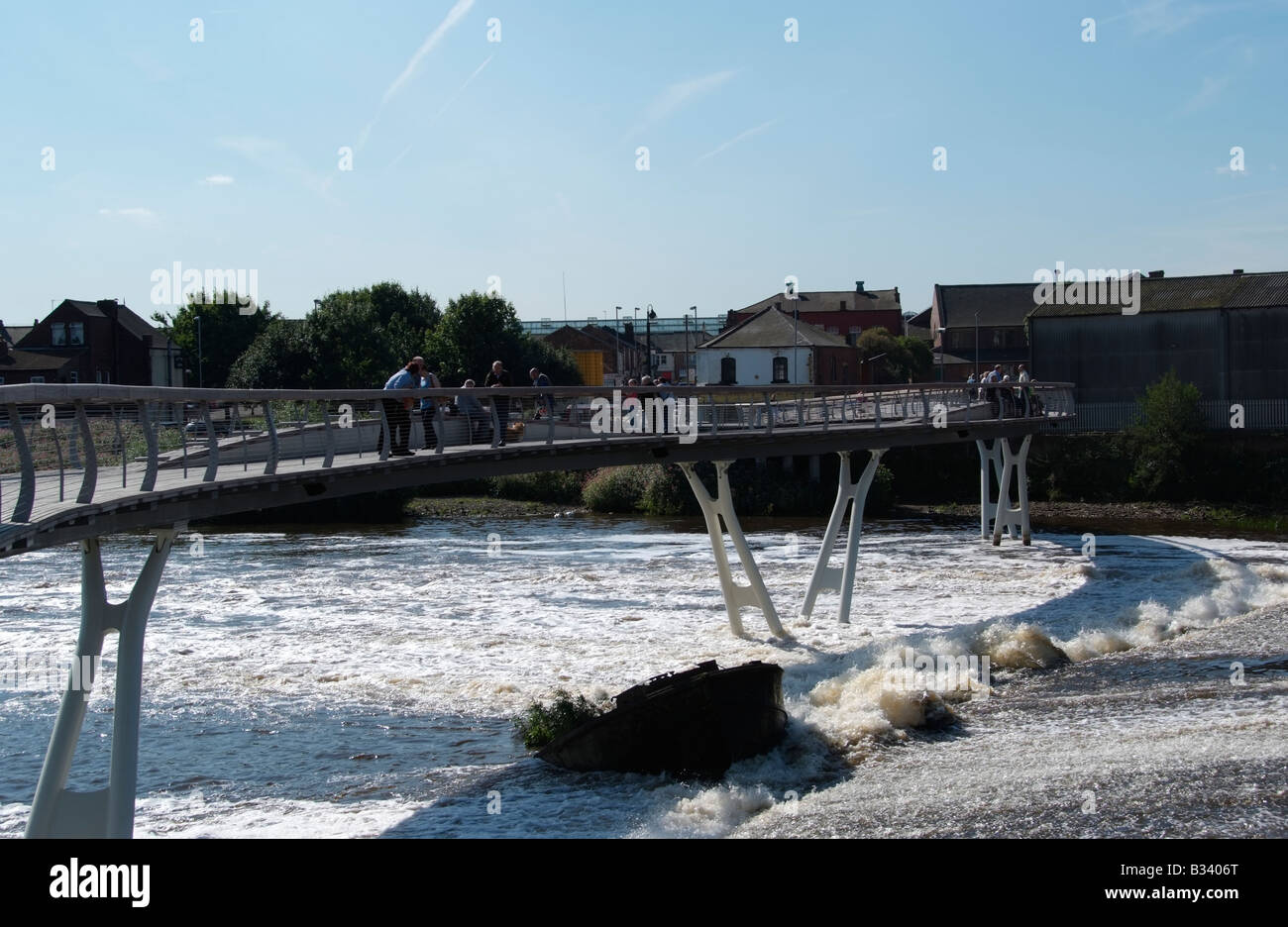 The new footbridge adjacent to the flour mill and the weir between Aire