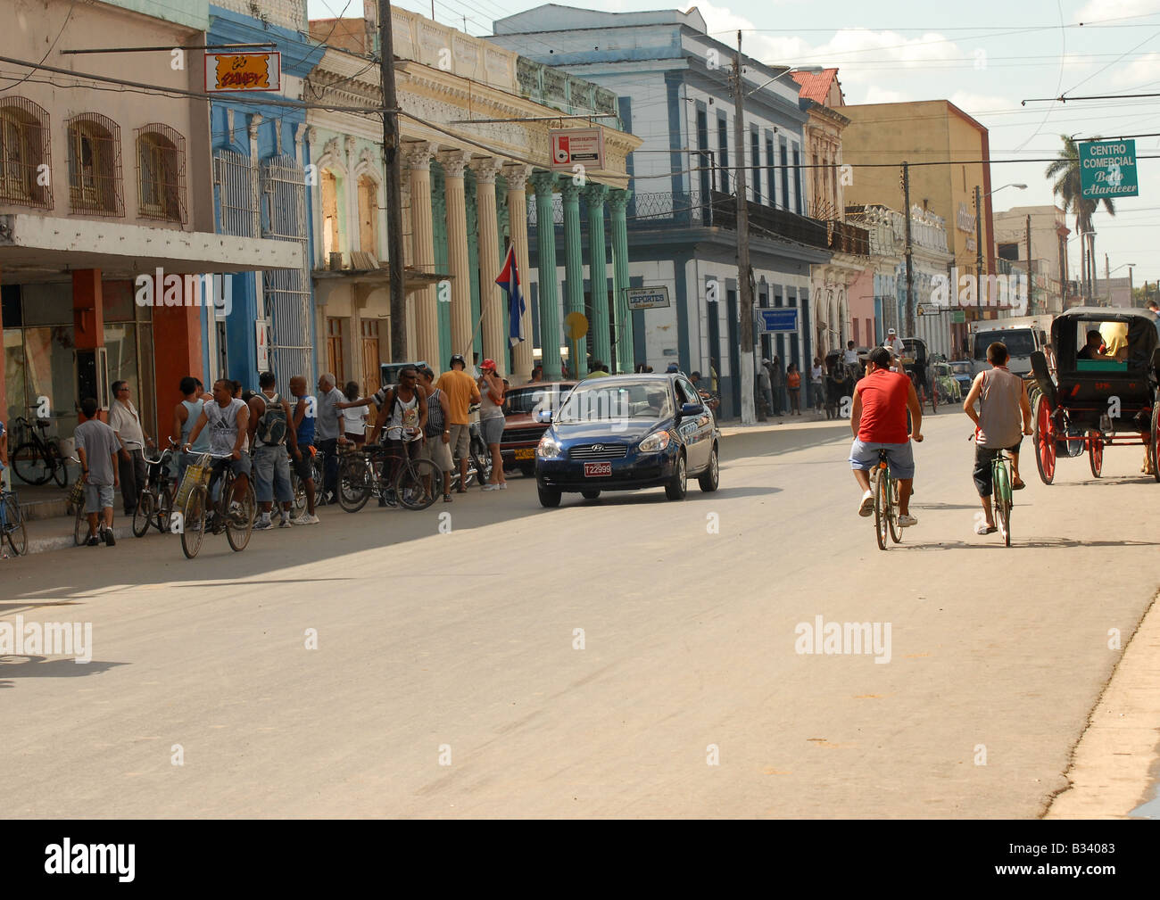 busy street scene in Cardenas Matanzas Province Cuba showing typical horse and carts old cars and bicycles with Cuban people Stock Photo