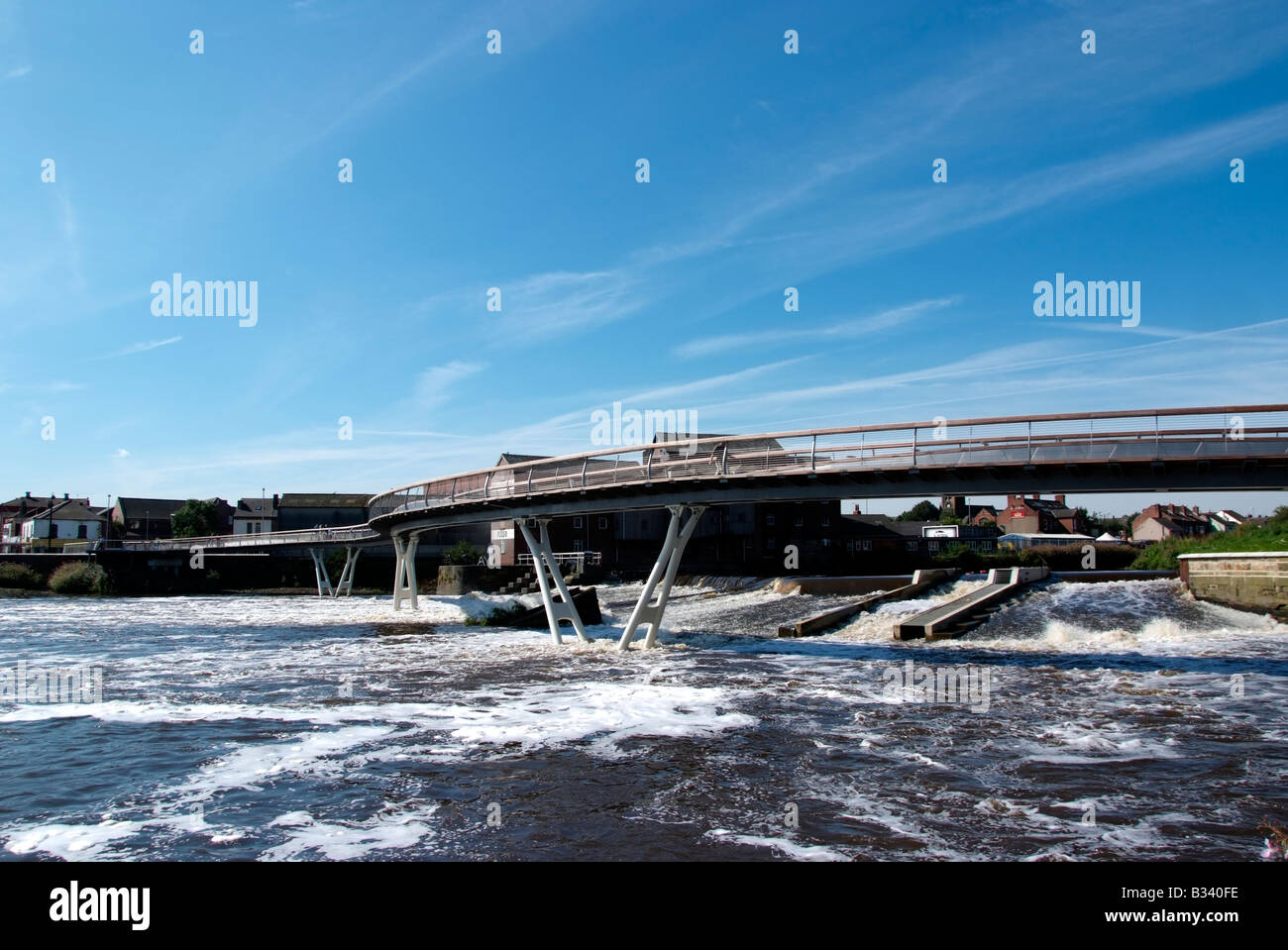 The new footbridge adjacent to the flour mill and the weir between Aire
