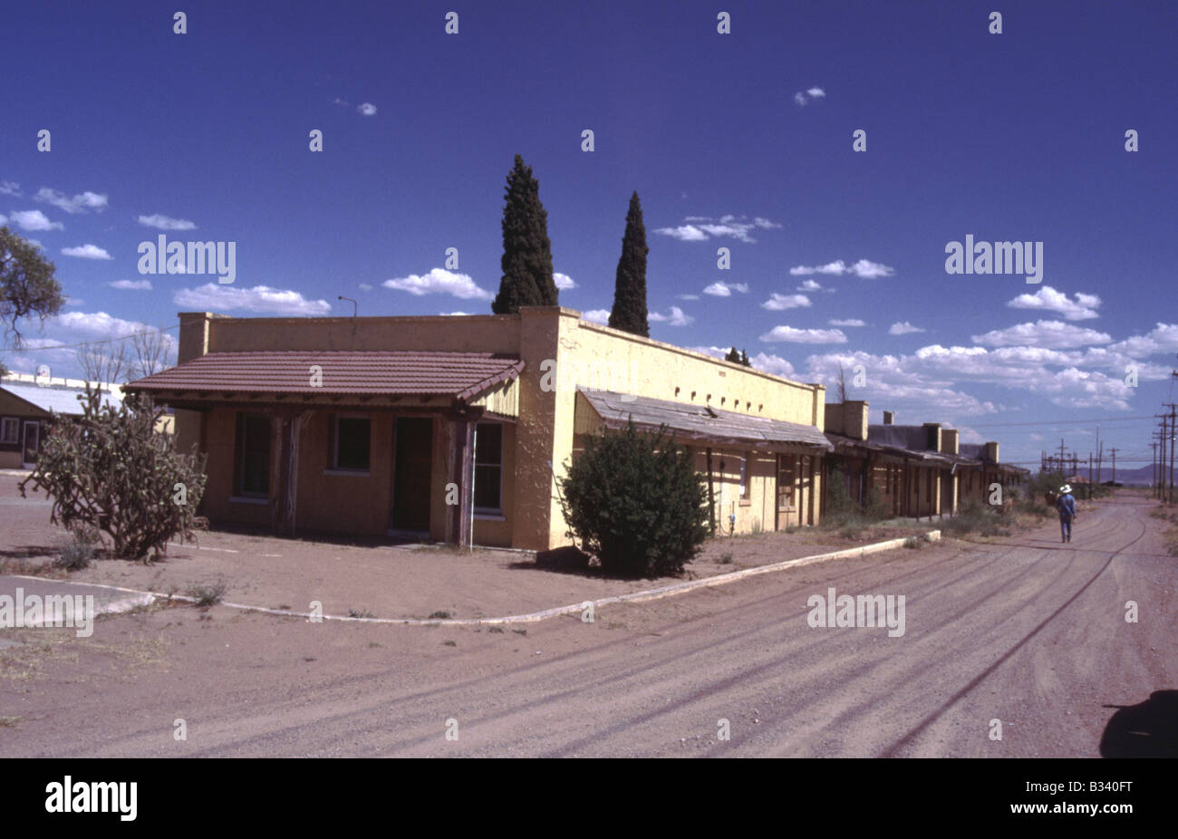 Street Scene with abandoned dwellings houses and dirt road in West Texas Stock Photo