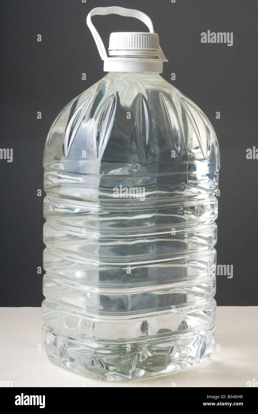 Five litres of bottled water in a clear plastic container Stock Photo
