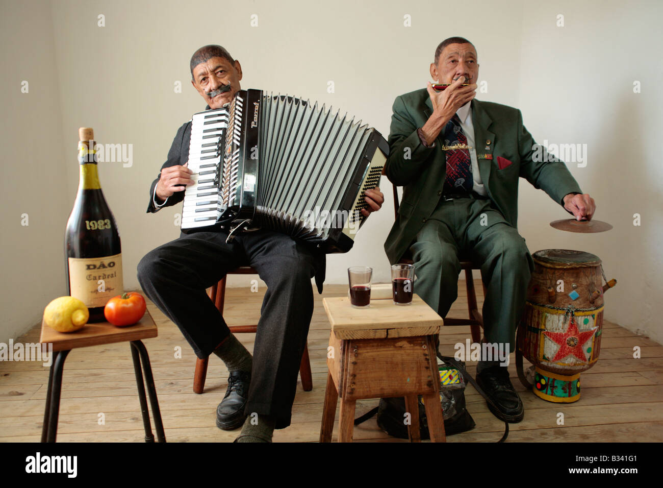 the 73 year old twins Joao and Fernando Nathis like to busk, Lagos, Algarve, Portugal Stock Photo
