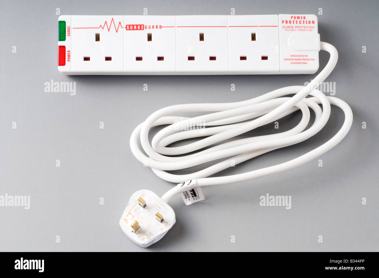 Four 4 socket 240 volt electric extension lead and Surge guard Stock Photo