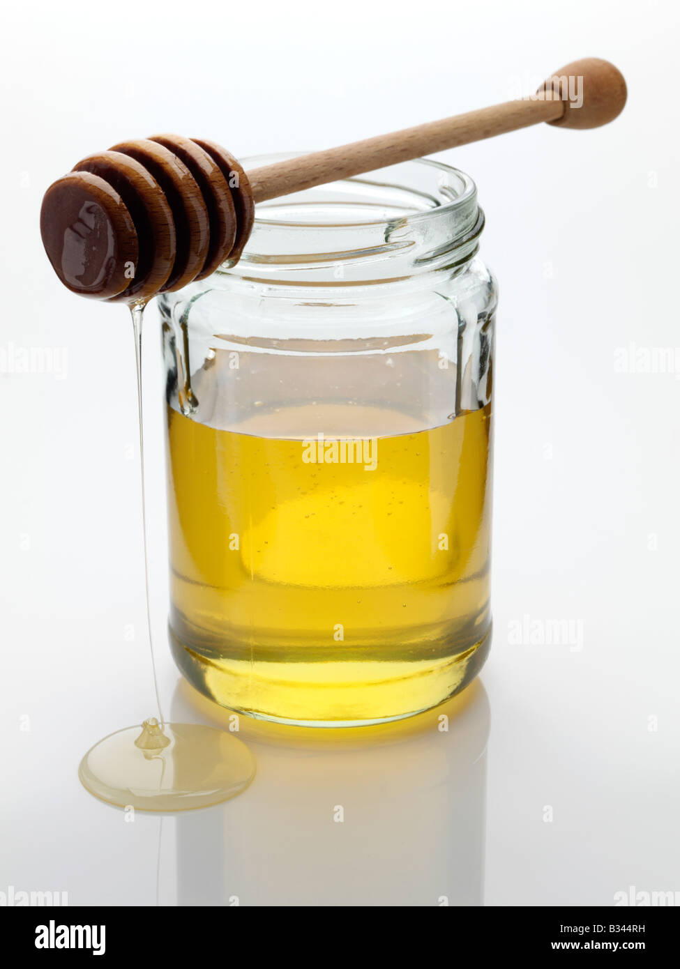 Honey wooden dipper dripper Stock Photo