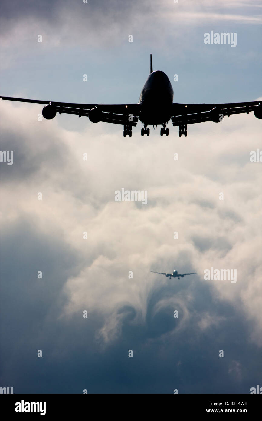 Commercial airplanes queuing up to land at London Heathrow Airport UK Stock Photo