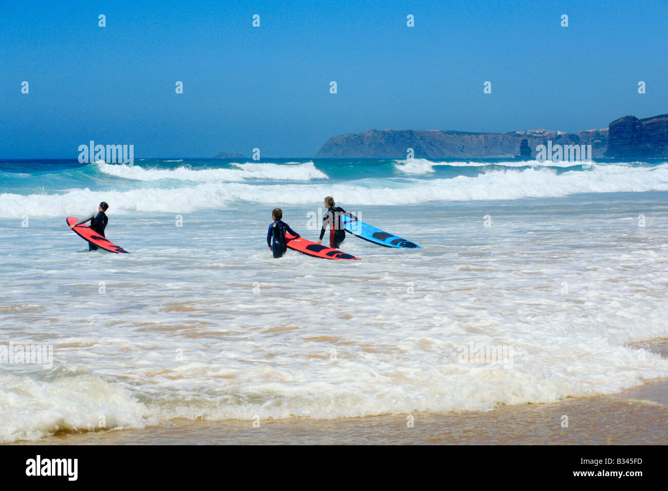 Surfer at the beach Praia de Vale de Figueira, Costa Dourada, Atlantic Coast, Portugal Stock Photo