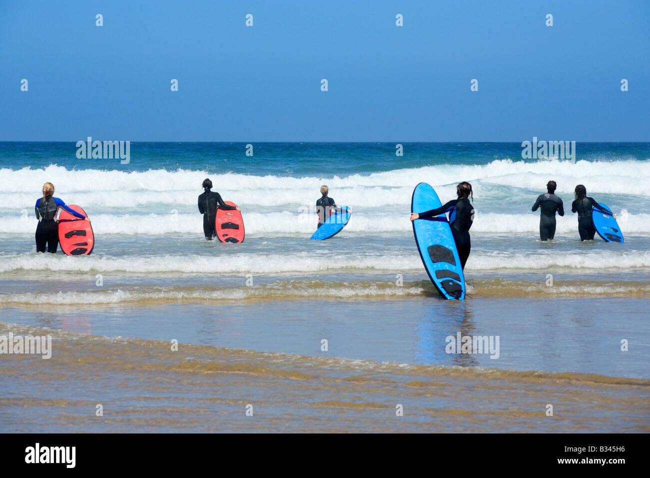 Surfer at the beach Praia de Vale de Figueira, Costa Dourada, Atlantic Coast, Portugal Stock Photo