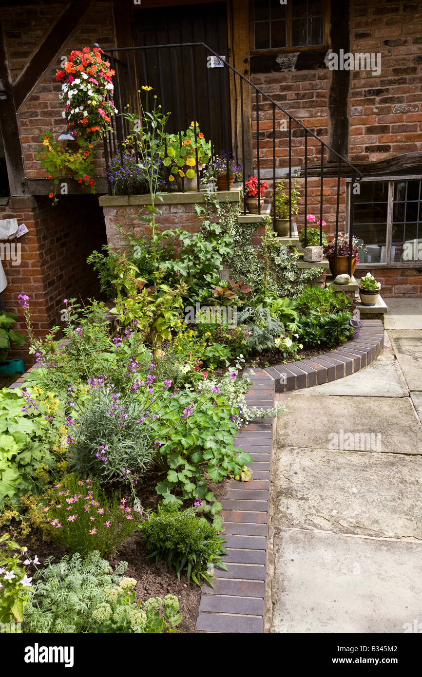 UK Cheshire Knutsford Heritage Centre colourful floral display in courtyard Stock Photo