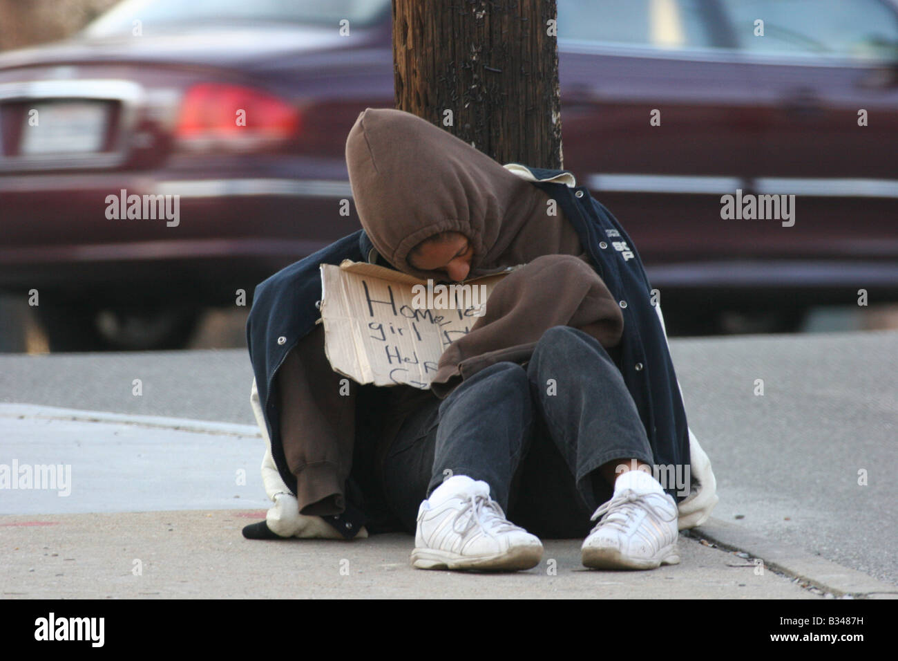 Homeless girl in winter Stock Photo