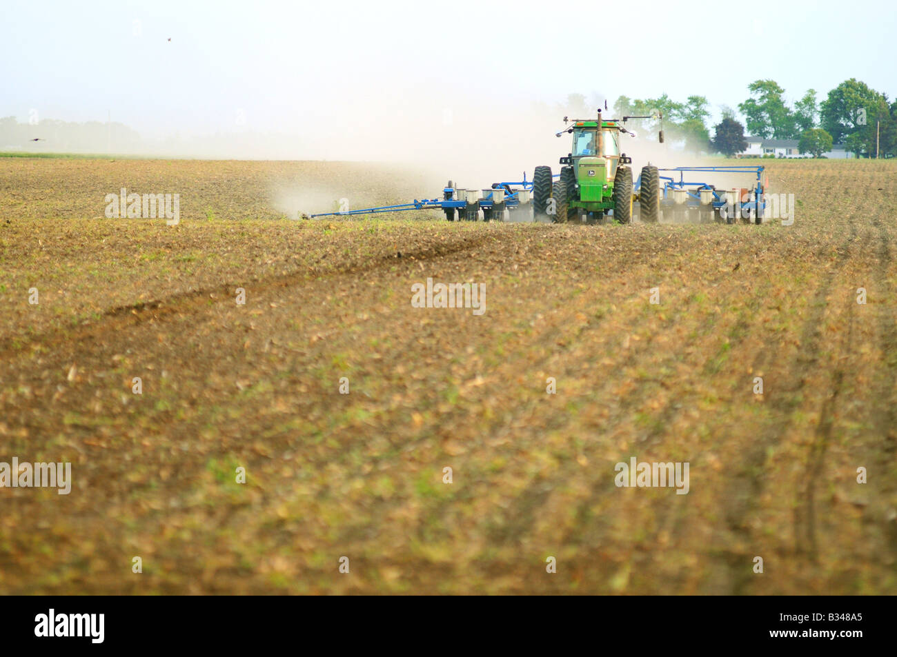 John Deere tractor planting corn or soybeans in an American farm ... for American Corn Farm
156eri John Deere tractor planting corn or soybeans in an American farm ... for American Corn Farm
156eri